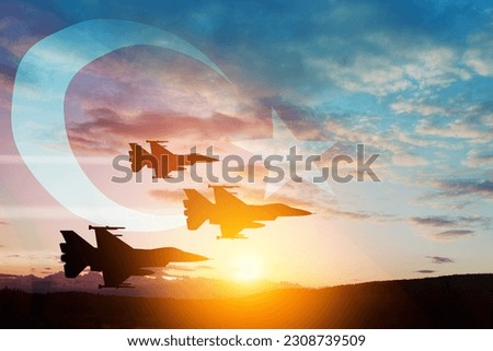 Aircraft silhouettes on background of sunset with a transparent Turkey flag. Air Force aerobatic demonstration. Air Force Day. Turkish Air Force Foundation Day. Royalty-Free Stock Photo #2308739509