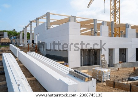 A new factory building is erected on a construction site 