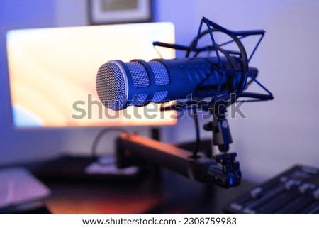 Microphone, mounted on desktop boom arm. 