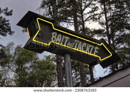 Vintage Neon Bait and Tackle Sign in Rural Area near Lake 