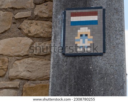 Weird Luxembourg sign on a wall 8-bit