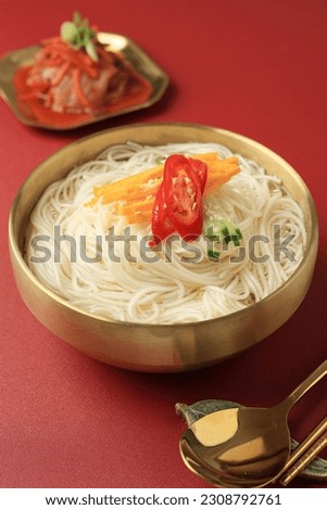Janchi Guksu, Korean Traditional White Somen Noodle Soup  with Anchovy Broth and Various Topping, Served with Kimchi. Party Banquet Menu in Korean Style Dish  Royalty-Free Stock Photo #2308792761