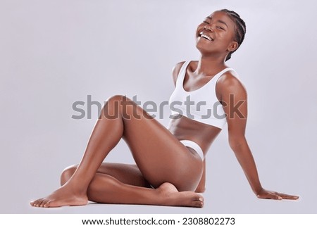 Body, underwear and legs model with cosmetic beauty, wellness and isolated in a white studio background. Luxury, skincare and portrait of person or woman for empowerment and health on the floor Royalty-Free Stock Photo #2308802273