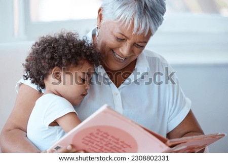 Family, girl and grandmother reading a book, story and quality time with happiness, bonding and fairy tale. Granny, female grandchild or kid with fun, literature or learning to read at home and relax Royalty-Free Stock Photo #2308802331