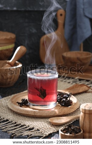 Tea is an aromatic beverage prepared by pouring hot or boiling water over cured or fresh leaves of Camellia sinensis, an evergreen shrub native to East Asia which probably originated in the borderland