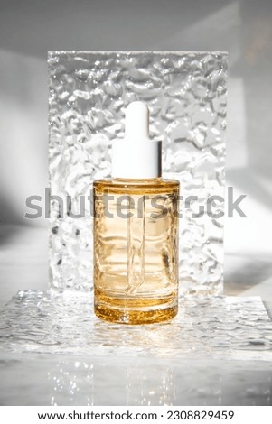 cosmetic bottles on marble top glitter background, natural light