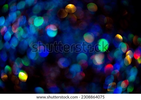 Bright shiny glowing bokeh art background. Festive abstract colorful background with bokeh defocused lights. Lights bokeh. Abstract background for overlay design. Royalty-Free Stock Photo #2308864075