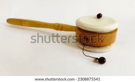 Dumplin hand drum, Rattle hand drum made of wood and leather isolated on a white background Royalty-Free Stock Photo #2308875541