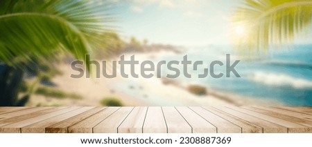 Wide Table top wooden bar on blurred beautiful beach scene background coconut leaf. Breakfast product display mockup outside vacation summer day time. Resort wood desk board on nature sea sand view.