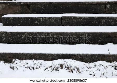 Stairways or staircase filled with white snow. Outside photo.