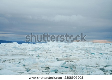 Huge icebergs floating in Ilulissat Icefjord Royalty-Free Stock Photo #2308903205