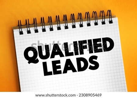 Qualified Leads - potential customers in the future, based on certain fixed criteria of your business requirements, text concept on notepad Royalty-Free Stock Photo #2308905469