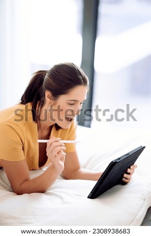 Woman at home using a tablet