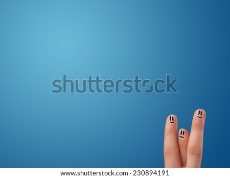 Happy smiley face fingers cheerfully looking at empty blue background copy space