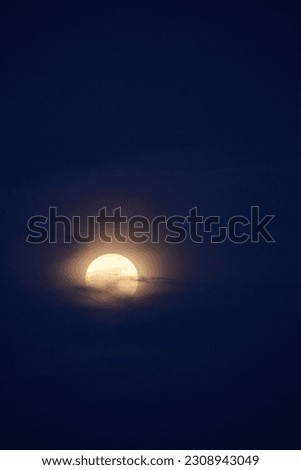 selective focus picture of moon and clouds