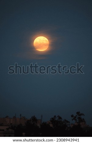 selective focus picture of moon and clouds