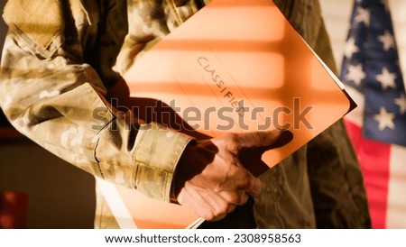 Folder of confidential documents a US Army officer Royalty-Free Stock Photo #2308958563