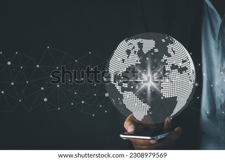 Businessman using smartphone with world vitual and connection line over black background use for global business,technology,network idea.