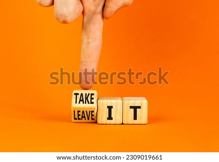 Take or leave it symbol. Businessman turns wooden cubes and changes words Leave it to Take it. Beautiful orange table orange background. Copy space. Business and take or leave it concept.