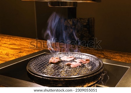 picture of Japanese table barbecue with meat on the roast