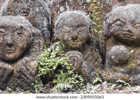 picture of Buddhist rakan stone statues at the Otagi Nenbutsu-ji temple in Arashiyama, Kyoto, Japan