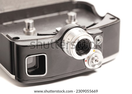 Vintage movie camera with filters isolated on white background.