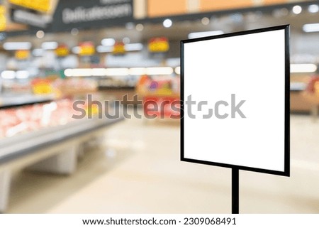 Blank price board with fresh food in supermarket abstract blurred background