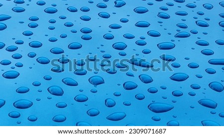 more water drops background on blue metal