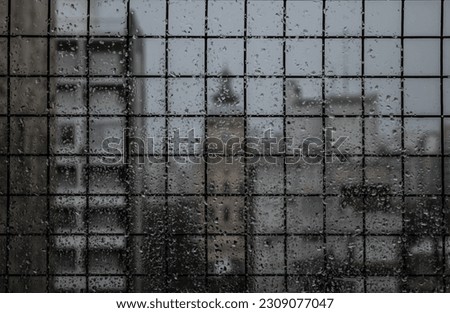 Scenic view of  window covered in raindrops