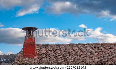 Red barred roof with wood-burning fireplace