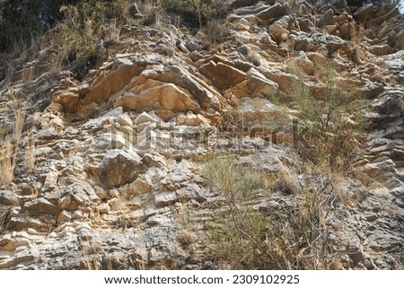 Flysch is a series of marine sedimentary rocks that are predominantly clastic in origin and are characterized by the alternation of lithological layers. Balkans, Montenegro, Zelenika, Herceg Novi Royalty-Free Stock Photo #2309102925