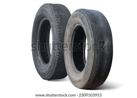 old worn out tire next to another old tire isolated on white background as sample of damaged tires from some tires Royalty-Free Stock Photo #2309103953