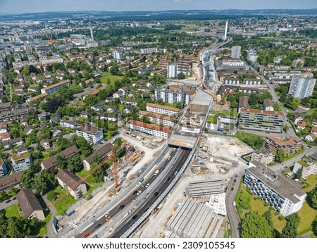 Aerial view of City of Zürich North with highway enclosure construction site on a sunny spring day. Photo taken May 27th, 2023, Zurich, Switzerland.