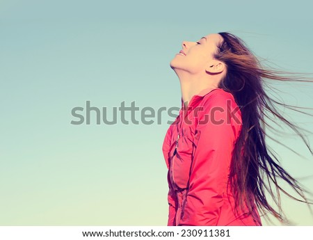 Woman smiling looking up to blue sky taking deep breath celebrating freedom. Positive human emotion face expression feeling life perception success peace mind concept. Free Happy girl enjoying nature Royalty-Free Stock Photo #230911381