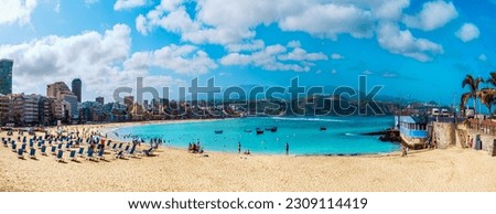 Panorama of the famous Las Canteras beach in the summertime, with tourists enjoying the summer holiday in Gran Canaria Royalty-Free Stock Photo #2309114419