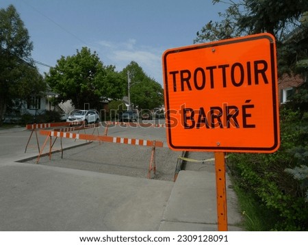 Road sign at a construction site on a street in Quebec, Canada