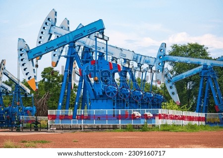 In the field country industry the oil rig pump in the evening of the pumping unit crude oil