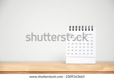 September Calendar 2023 on table background.Time planning, day counting and holidays Royalty-Free Stock Photo #2309163663