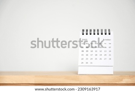 October Calendar 2023 on table background.Time planning, day counting and holidays Royalty-Free Stock Photo #2309163917