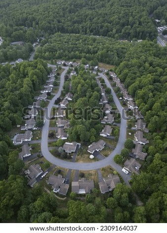 Ariel photos of a housing development in the mountains of Pennsylvania. Hd drone photos of a suburban development in the forest. 