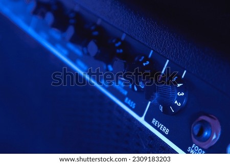 Reverb controls on an acoustic amp. Effects controls add depth and dimension to an acoustic guitar or acoustic instrument. Royalty-Free Stock Photo #2309183203