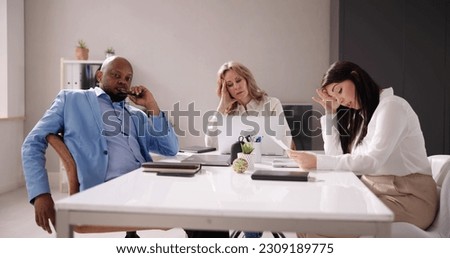 Diverse Tired Young Businesspeople Bored During Meeting In Office