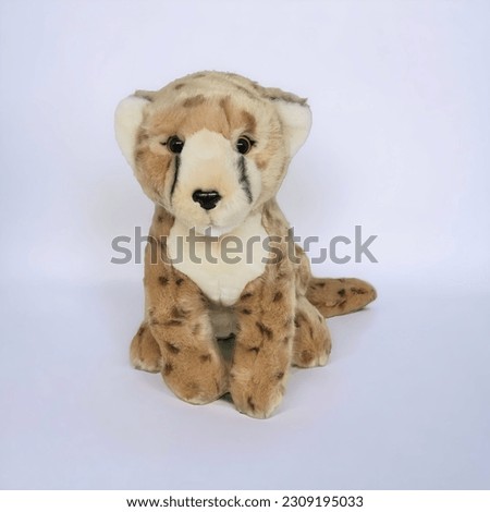 Cheetah stuffed animal in brown color on a white background