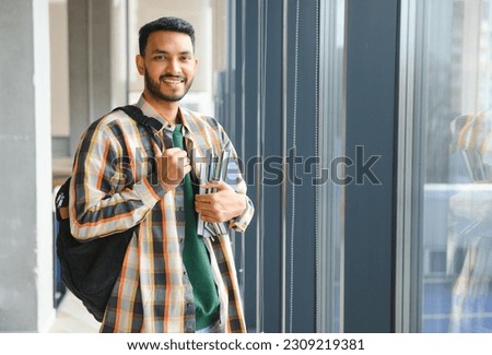 Handsome and young indian Male college student