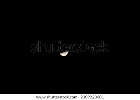 A detailed half moon on a completly black background