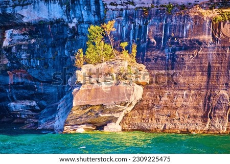 Lake Superior Pictured Rocks National Park sunny boulder with massive cliff edge in shadow