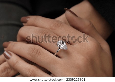 Diamond ring with model hand ,Silver golden plated jewelry ring for girls  Royalty-Free Stock Photo #2309225901