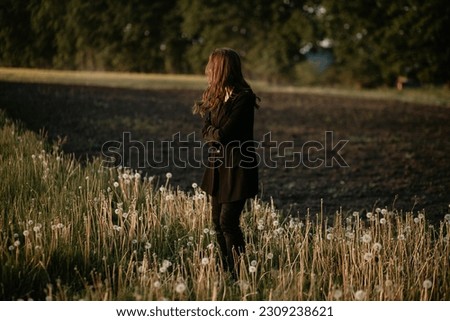 lonely sad girl dancing in the field