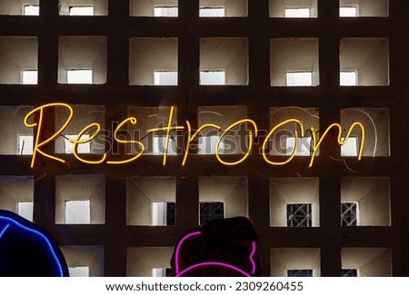 Restroom icons set, Neon light color blue restroom sign on a wall, Toilet sign, Restroom Concept