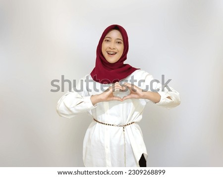 Lady with Red hijab so cheerful on Independence day pose.